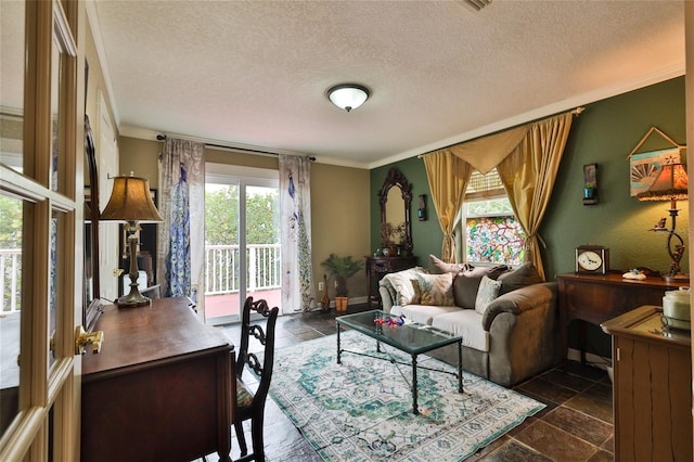 living room with dark tile floors, a textured ceiling, and crown molding