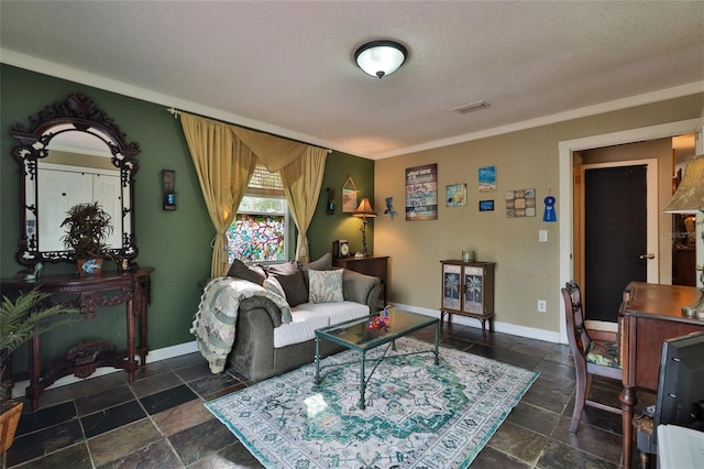 tiled living room featuring a textured ceiling and ornamental molding