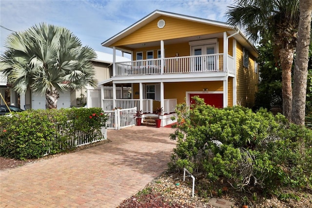 view of front of house with a balcony and a garage