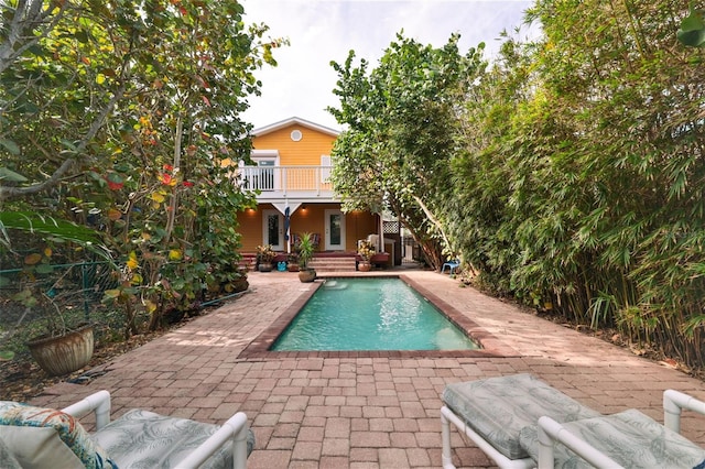 view of swimming pool featuring a patio