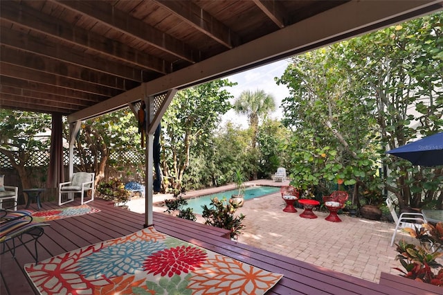 wooden deck with a patio area