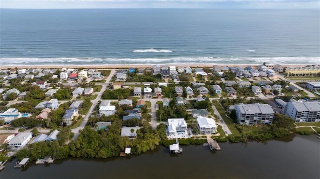 aerial view featuring a water view and a beach view