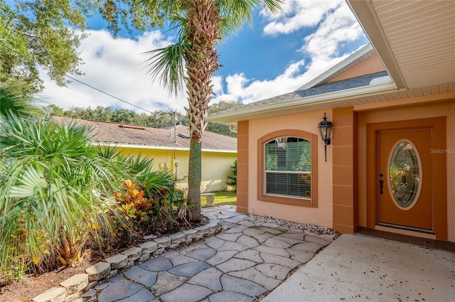 doorway to property featuring a patio area