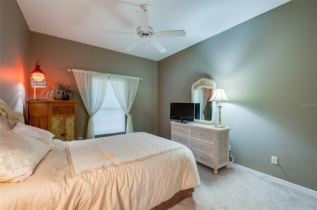 bedroom featuring light carpet and ceiling fan