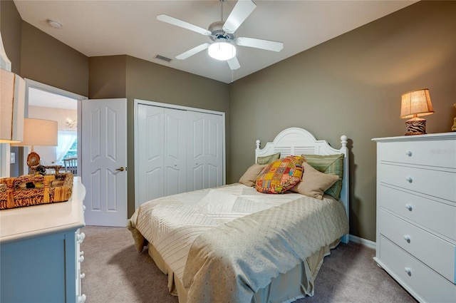 carpeted bedroom with a closet and ceiling fan