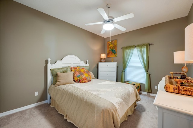 bedroom with light carpet and ceiling fan