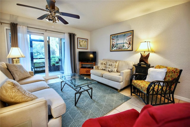 tiled living room with ceiling fan