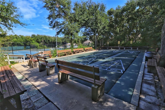 view of nearby features featuring tennis court