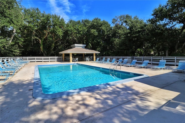 view of swimming pool with a gazebo and a patio