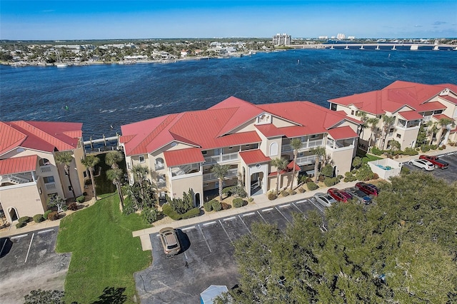 birds eye view of property featuring a water view