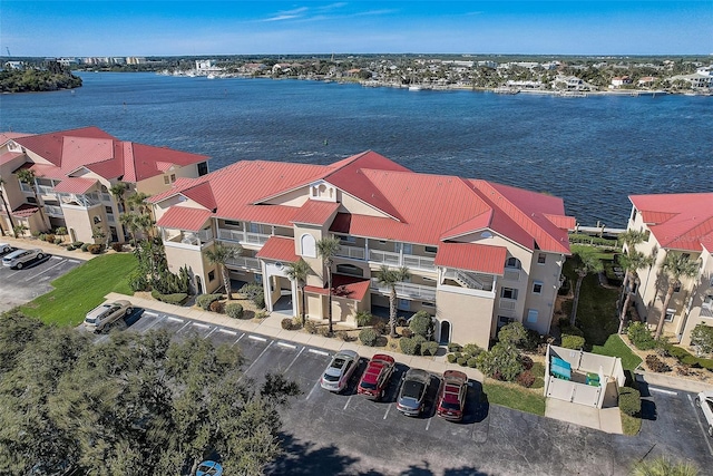 birds eye view of property featuring a water view