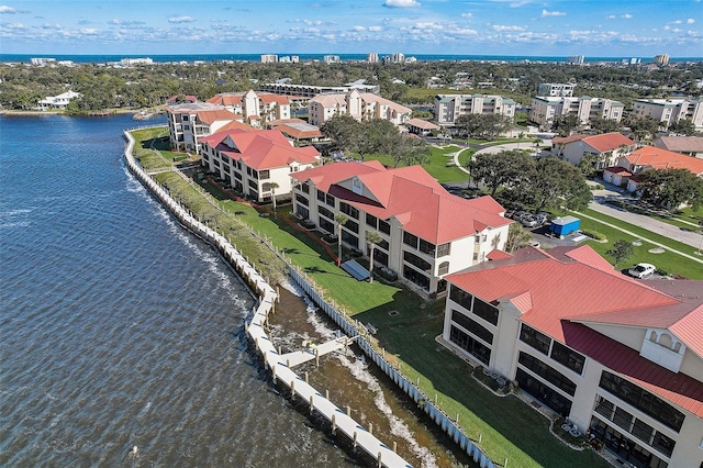 birds eye view of property with a water view