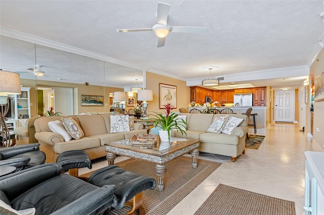 tiled living room featuring ceiling fan and ornamental molding