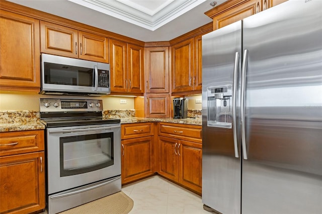 kitchen featuring appliances with stainless steel finishes, light stone counters, light tile flooring, and ornamental molding
