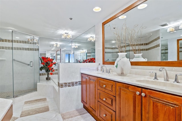 bathroom with dual vanity, tile flooring, independent shower and bath, and tile walls