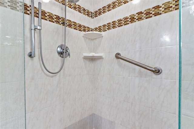 bathroom with tiled shower