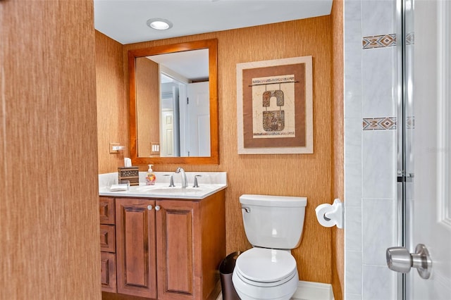 bathroom with toilet and large vanity
