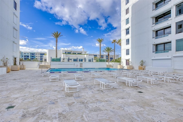 view of swimming pool featuring a patio