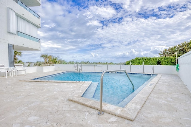 view of pool with a patio area