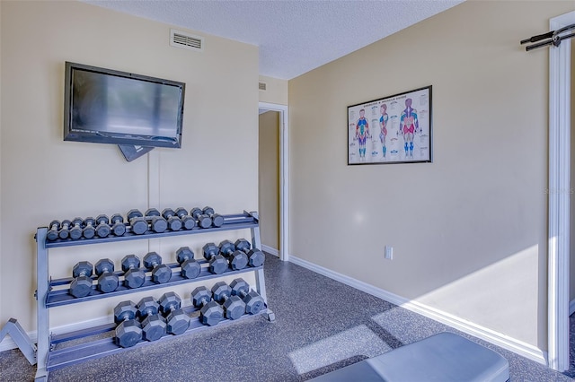 exercise area with a textured ceiling