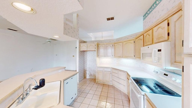 kitchen featuring light brown cabinetry, white appliances, ceiling fan, sink, and light tile flooring