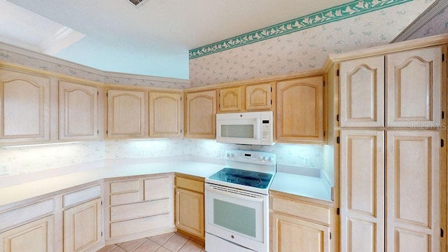 kitchen featuring light brown cabinets, white appliances, and light tile floors