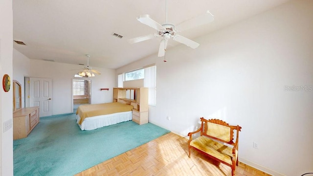 bedroom featuring parquet floors and ceiling fan