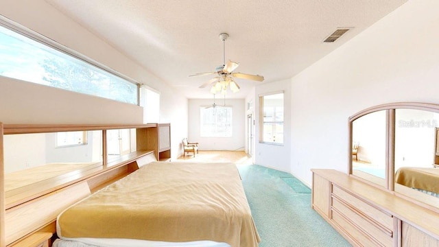 bedroom featuring ceiling fan and light colored carpet