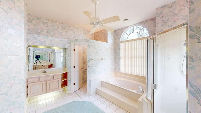 bathroom with independent shower and bath, vanity, ceiling fan, and tile flooring