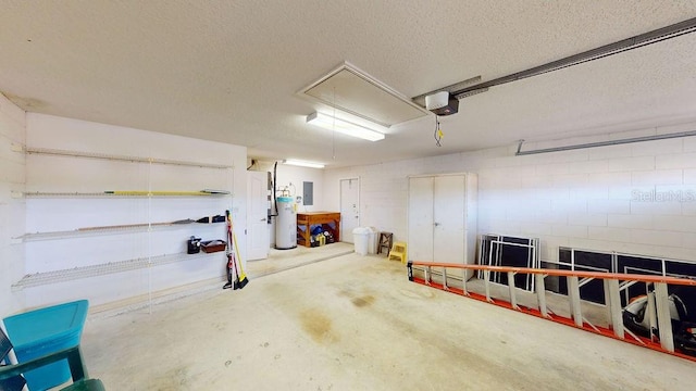 garage with a garage door opener and water heater