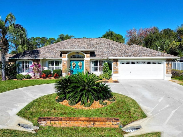 single story home with a front lawn and a garage