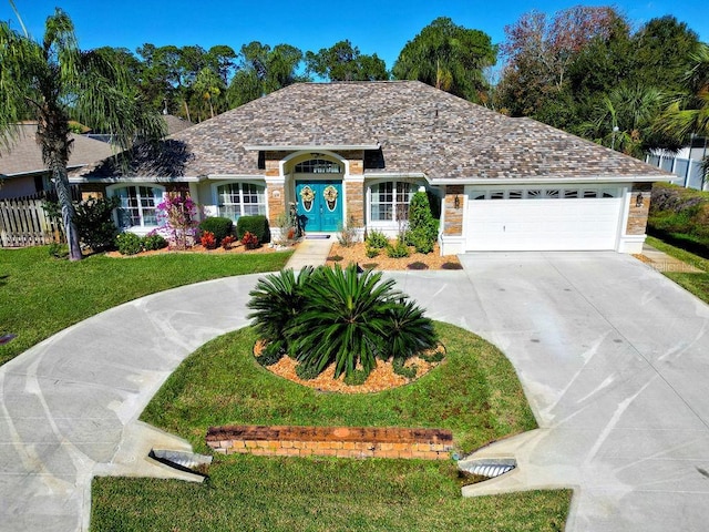 single story home with a front lawn and a garage