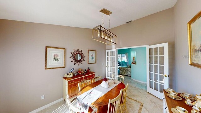 dining room with light tile floors and french doors