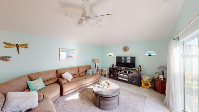 living room featuring light tile floors and ceiling fan