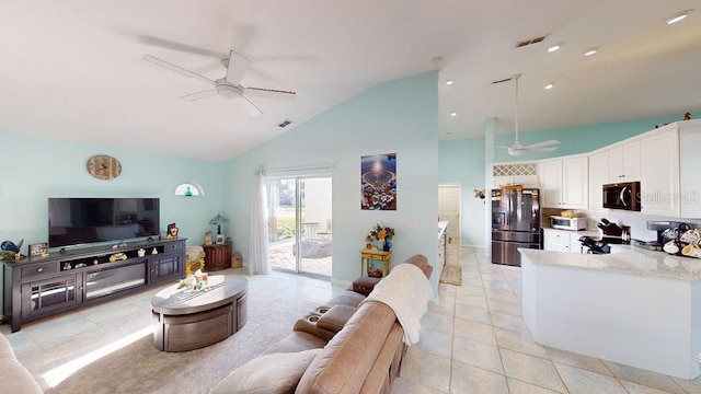 living room with high vaulted ceiling, ceiling fan, and light tile flooring