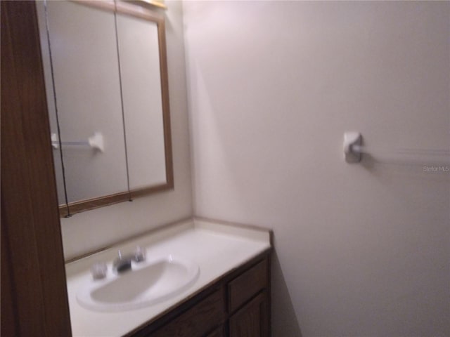 bathroom featuring vanity with extensive cabinet space