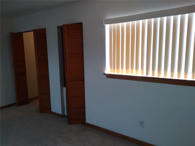 unfurnished bedroom featuring carpet