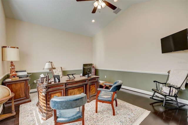 home office with dark hardwood / wood-style floors, ceiling fan, and vaulted ceiling