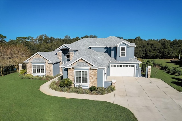 view of front of house with a front lawn and a garage