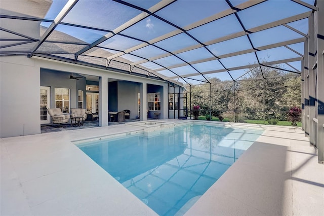 view of pool featuring a lanai, ceiling fan, and a patio area