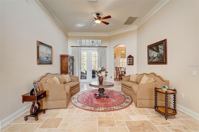 living room with light tile flooring, ornamental molding, ceiling fan, and french doors