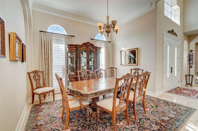 dining area featuring a notable chandelier, crown molding, light tile floors, and a wealth of natural light