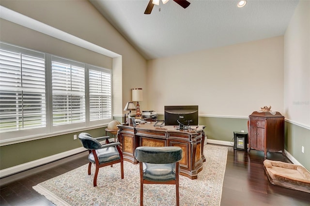 home office featuring vaulted ceiling, ceiling fan, and dark hardwood / wood-style floors