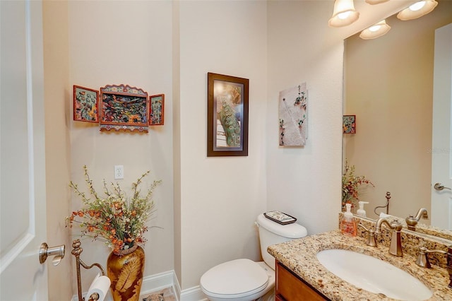 bathroom with oversized vanity and toilet