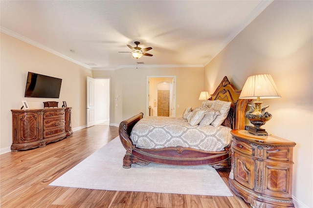 bedroom with light hardwood / wood-style floors, ceiling fan, ensuite bathroom, and ornamental molding