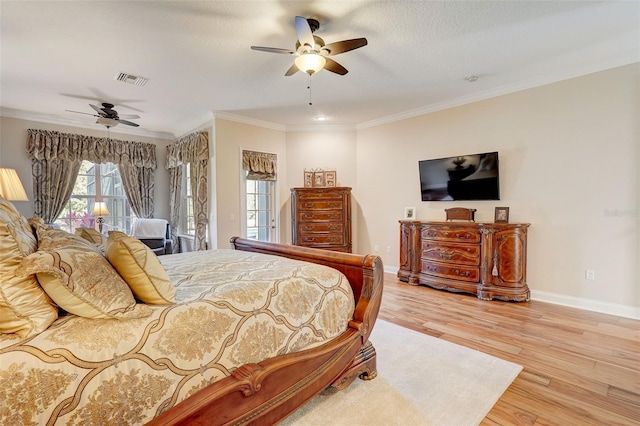 bedroom with access to exterior, light hardwood / wood-style floors, ceiling fan, and crown molding