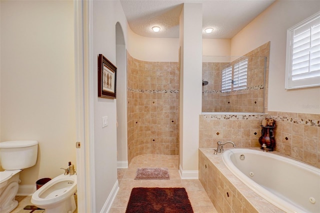 bathroom with shower with separate bathtub, toilet, a bidet, and tile flooring