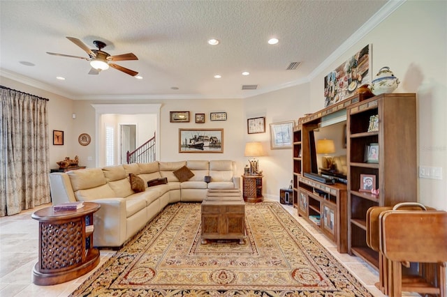 tiled living room with crown molding and a textured ceiling