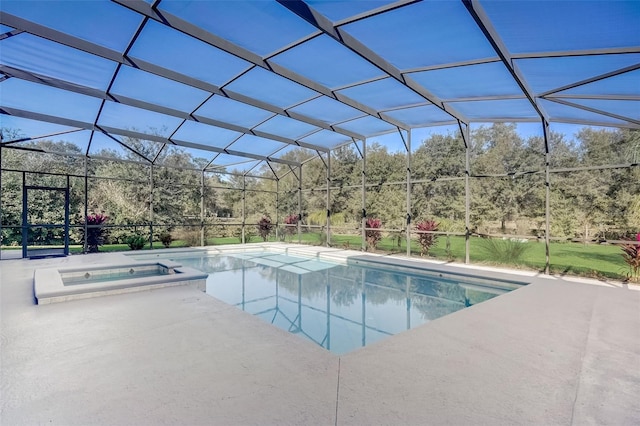 view of pool with a patio, an in ground hot tub, and a lanai