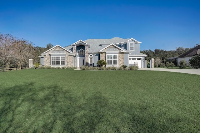 view of front facade with a front lawn and a garage